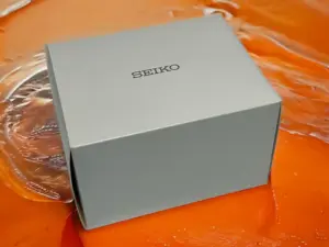 The packaging of the Seiko SRPD Mod Black and Orange watch box.